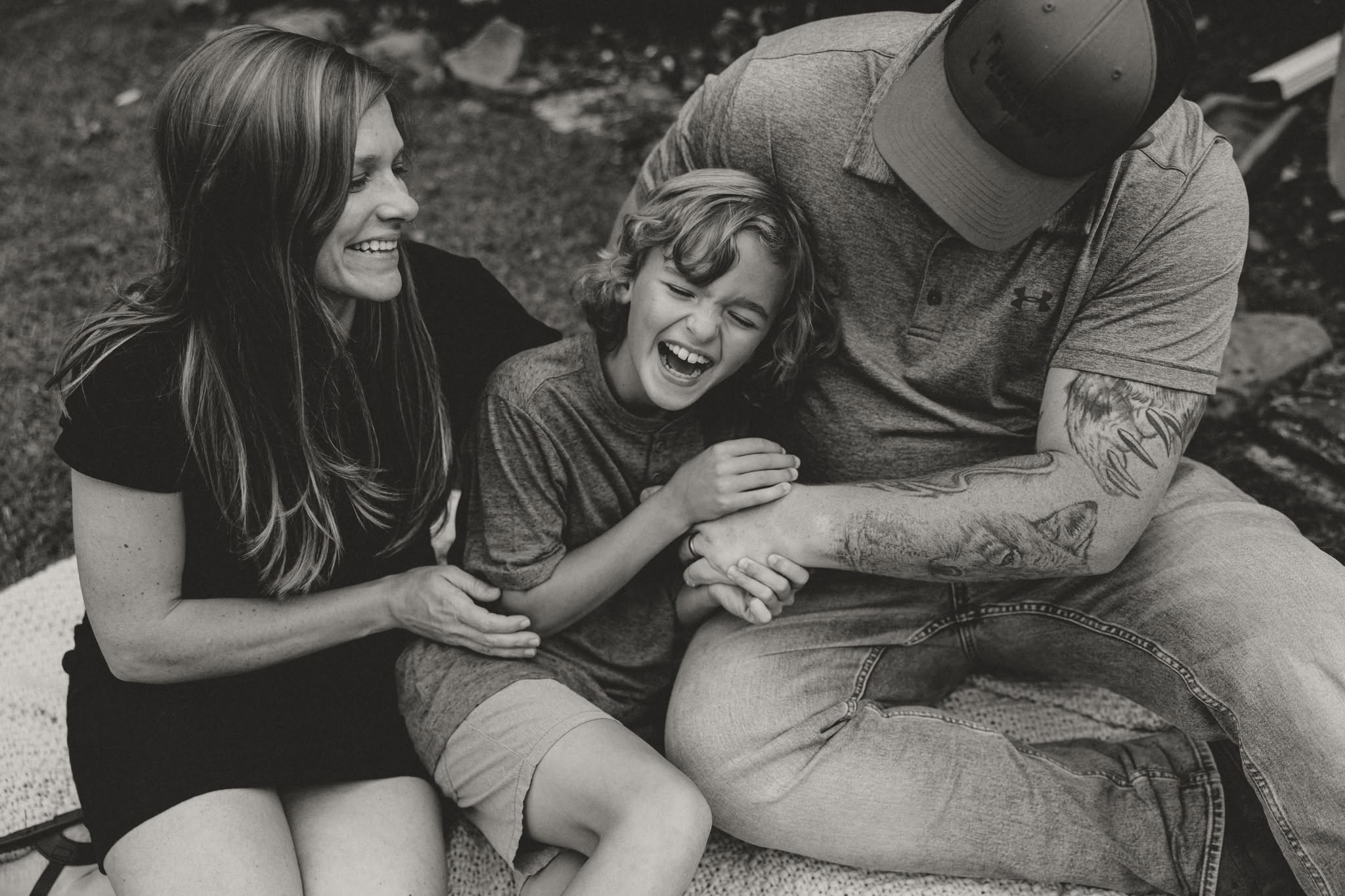 Family laughing together, black and white